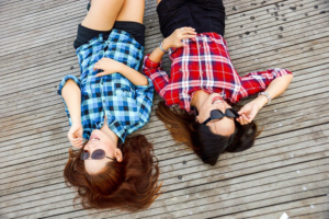 Two woman lying on the floor