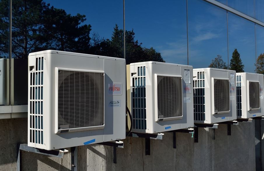 Four AC outside units on a wall in Los Gatos, CA