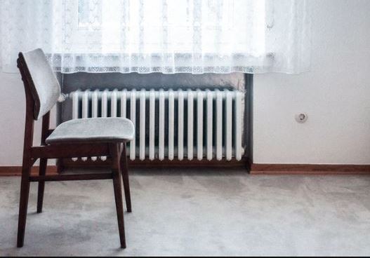 A vent attached to a wall inside a house